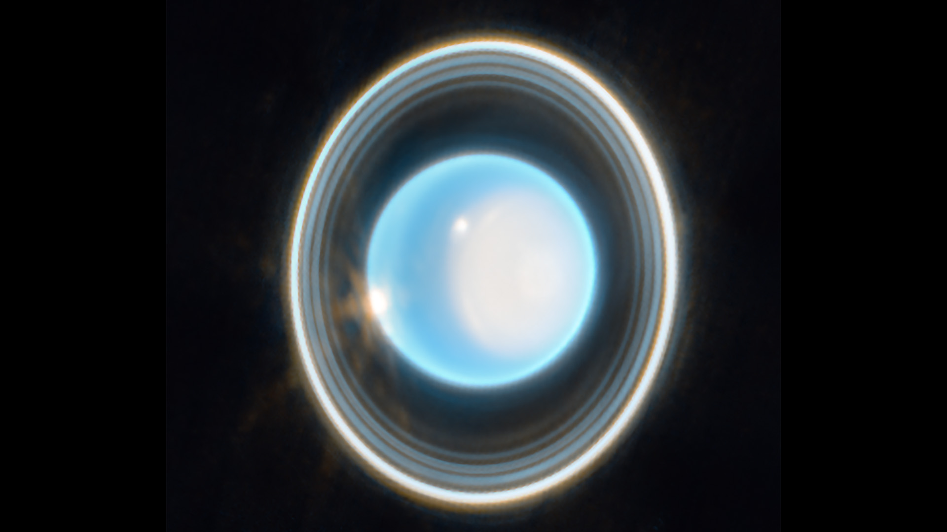 A close-up image of Uranus, showing its glowing blue and white atmosphere and its concentric rings.