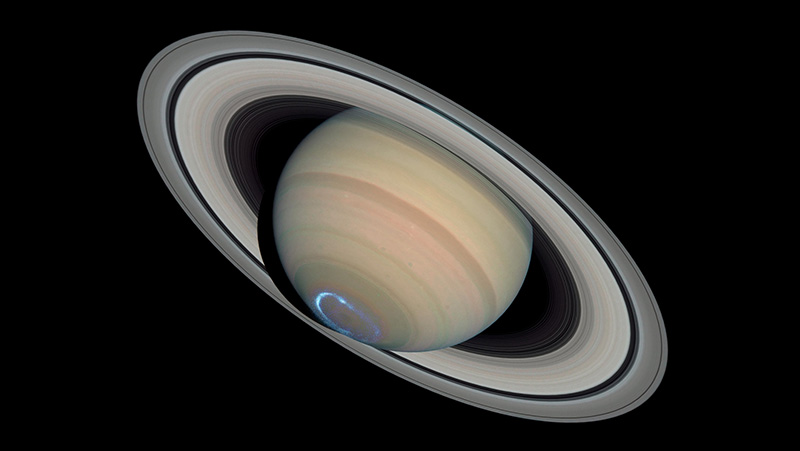 Saturn against the black void of space.